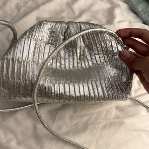 Sleek and silver clutch.